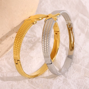 Modern 18K gold plated stainless steel bangles with woven texture and X pattern details