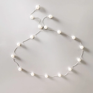 Elegant minimalist pearl waist chain belt with white beads on a slim silver metal link chain