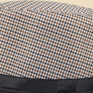 Classic houndstooth jazz fedora hat with brown black white weaving and black band detail