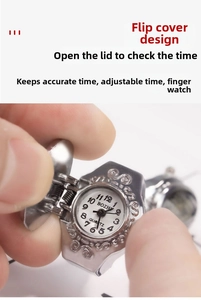 Detailed close-up of a vintage floral silver finger watch with a functional flip cover