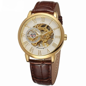 Detailed view of luxury gold skeleton dial and brown leather strap on mechanical watch