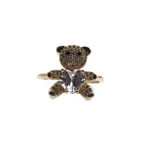 Gold plated bear ring with heart shaped zircon and shimmering stones on white background