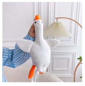 Detailed view of plush white goose bag featuring soft faux fur and adjustable strap