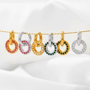 Stainless steel hoop earrings with crystal oval charms in gold and silver finish