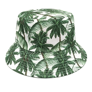 Close-up of tropical green palm tree prints and reinforced stitching on white bucket hat
