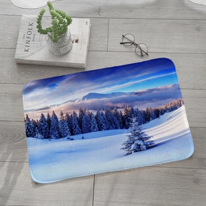 Absorbent flannel floor mat featuring a realistic winter snow mountain forest landscape