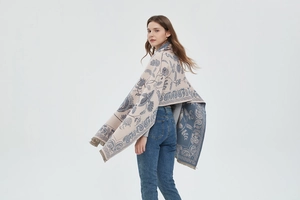Detail of soft pashmina shawl featuring double-sided paisley patterns and tassel edges
