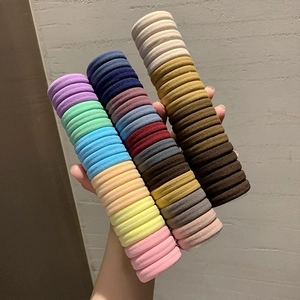 High-elastic colorful hair scrunchie set displayed on a transparent cylinder holder