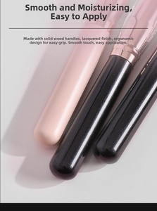 Detail of ergonomic solid wood brush handles with premium rose gold metal ferrule