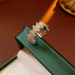 Macro shot of layered crown ring with micro-p镶 inlaid cubic zirconia on a jewelry box