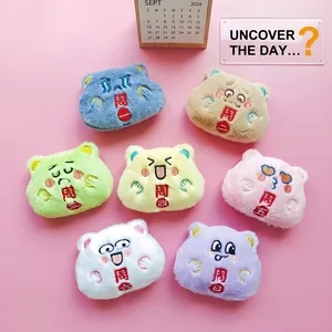 Detailed view of seven colorful plush dog doll brooches with weekday embroidery sets