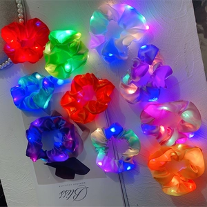 Luminous LED scrunchies made of shiny satin fabric in various colors for party hair styling