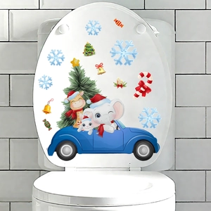 Christmas Santa car and animal stickers on white toilet lid with snowflake decals