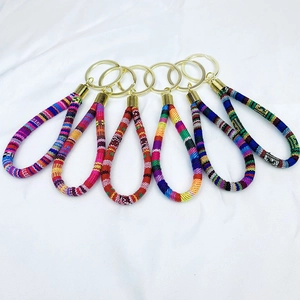 Set of five bohemian woven wristlet keychains with ethnic patterns and gold metal rings