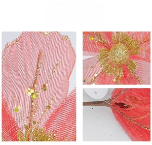 Macro shot of red mesh Christmas flower petals with gold glitter and sequin details