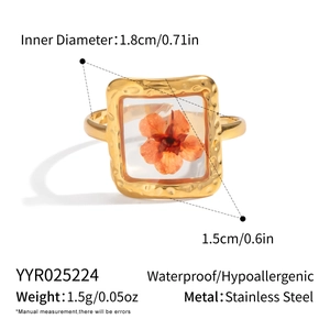 Detailed size specifications for gold stainless steel ring with orange dried flowers