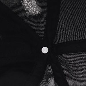 Macro detail of inner crown structure with reinforced webbing on washed denim cap
