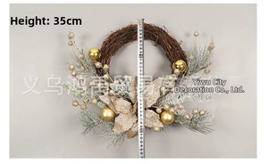 Detail view of a 35cm Christmas wreath with gold poinsettia and pine needles