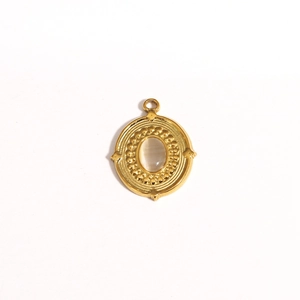 Detailed view of a gold oval opal pendant with vintage beaded border and jewelry hook