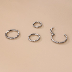Titanium hinged clicker rings with cubic zirconia stones for nose and ear piercings