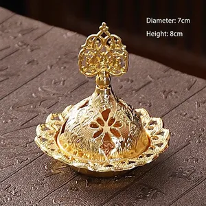 Macro detail of golden metal incense burner with 7cm diameter and 8cm height dimensions