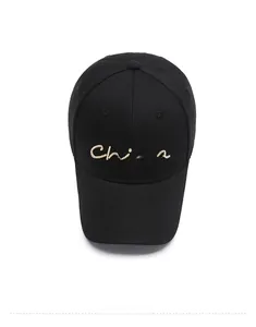 Top view of a black cotton baseball cap featuring gold China embroidery on white background