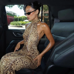 Detail of sexy leopard print backless halter dress showing sleeveless cut and slim fit