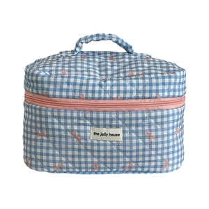 Quilted blue checkered makeup bag with pink butterflies and top handle for travel