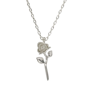 Detail of a silver rose flower pendant necklace in polished stainless steel for women