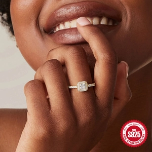 Classic square halo S925 sterling silver engagement ring worn by a female model