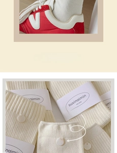 Close-up of cream-white ribbed cotton mid-calf socks with decorative shell buttons