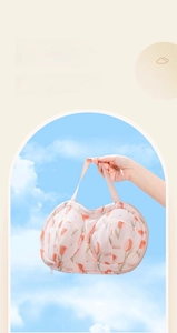 Detail of tulip patterned laundry bag showing breathable mesh and durable zipper