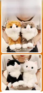Detail showing four fluffy sitting cat plush toys in orange, grey, tuxedo, and white colors