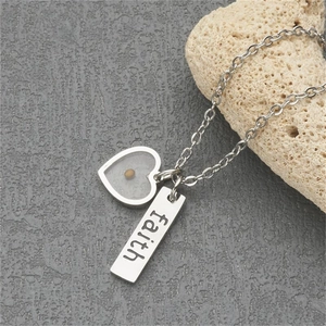 Minimalist silver stainless steel necklace with heart pendant and faith engraved tag