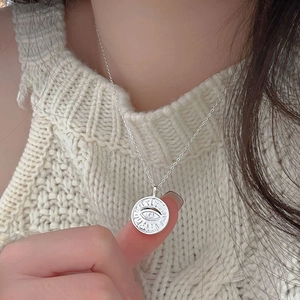 925 sterling silver coin necklace featuring an Evil Eye pendant on a fine link chain