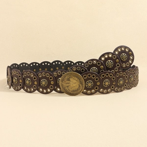 Detail of dark brown western belt featuring vintage bronze rivets and ornate buckle