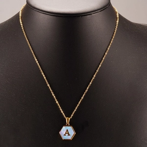 Gold 18K stainless steel necklace with hexagon shell pendant featuring letter A