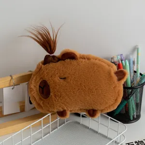 Close-up of plush Capybara pencil case with a cute ponytail placed on a white wire basket