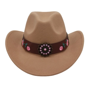 Detail of camel wool cowboy hat with floral embroidery and vintage metal turquoise stud