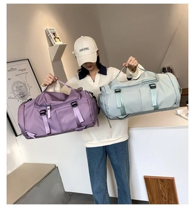 Detail of purple and grey waterproof nylon travel bags with reinforced buckles
