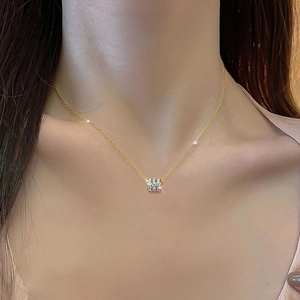 Elegant gold titanium steel necklace featuring a three-ring pendant with white zircon stones