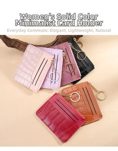 Macro detail of multi-color faux crocodile leather card holders with metal zipper and key ring