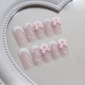 Elegant white French press-on nails with pink bows and pearl accents 24pcs set