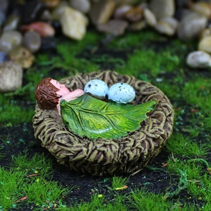 Miniature sleeping baby in resin bird nest with leaf blanket for garden landscape decor