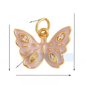 Macro view of butterfly pendant showing 16mm width and zircon wing details in gold