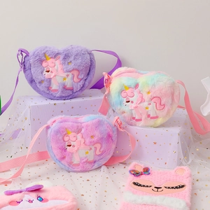 Detailed view of plush unicorn heart bags and soft notebook for girls' gift set