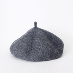 Classic grey-blue wool felt beret with pumpkin design on a minimalist white background
