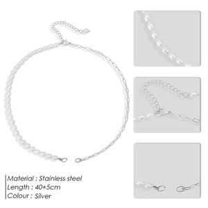 Detail view of silver stainless steel chain and freshwater pearls with lobster clasp