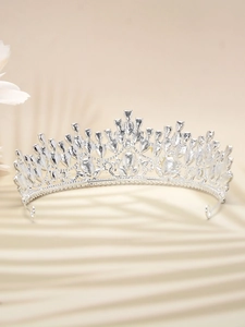 Close-up of silver vintage bridal tiara with sparkling crystals and leaf patterns