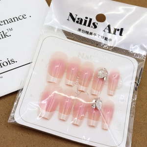 French nude blush press-on nails with sparkling rhinestones in 10pcs retail packaging